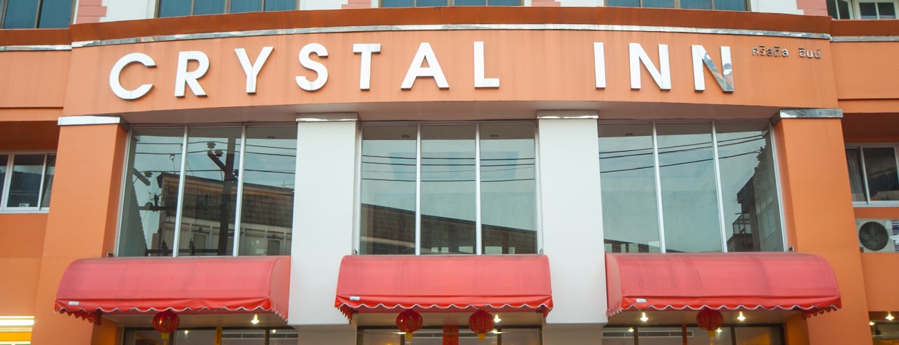 in front of Crystal Inn Hotel